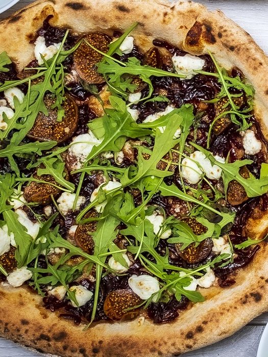 Figgi Smalls pizza: figs, goats cheese, caramelised red onion and a pile of wild rocket